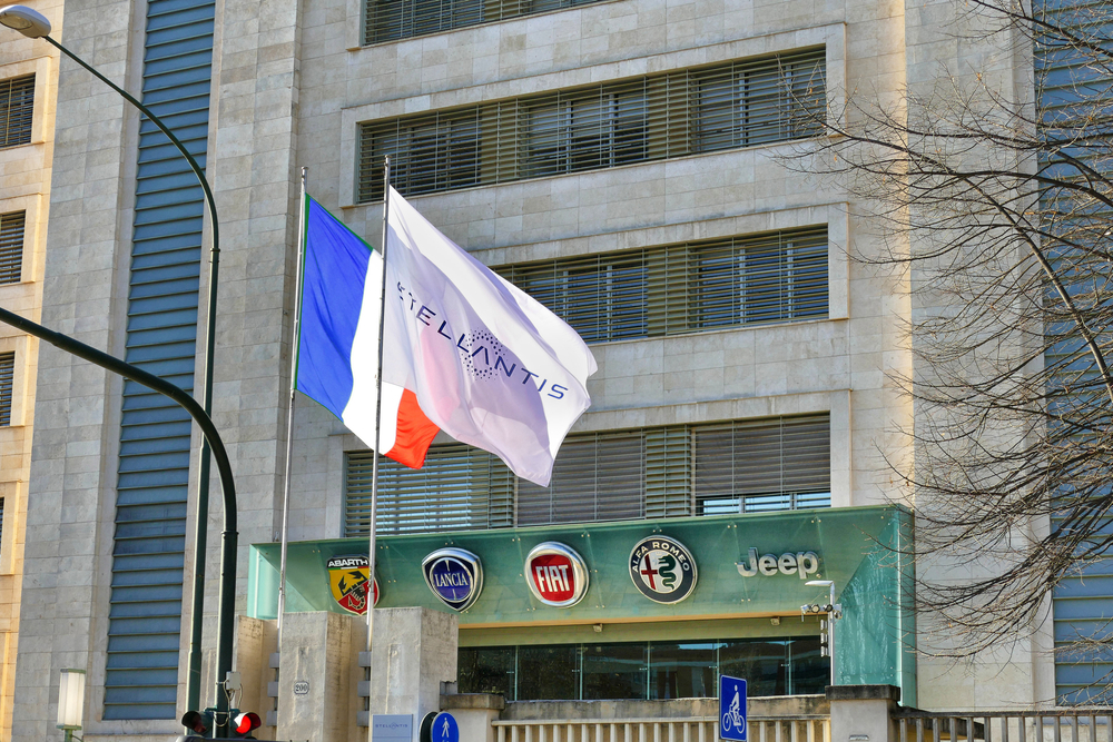 Fake,French,Flag,And,Stellantis,Corporation,Flag,At,Italian,Headquarters